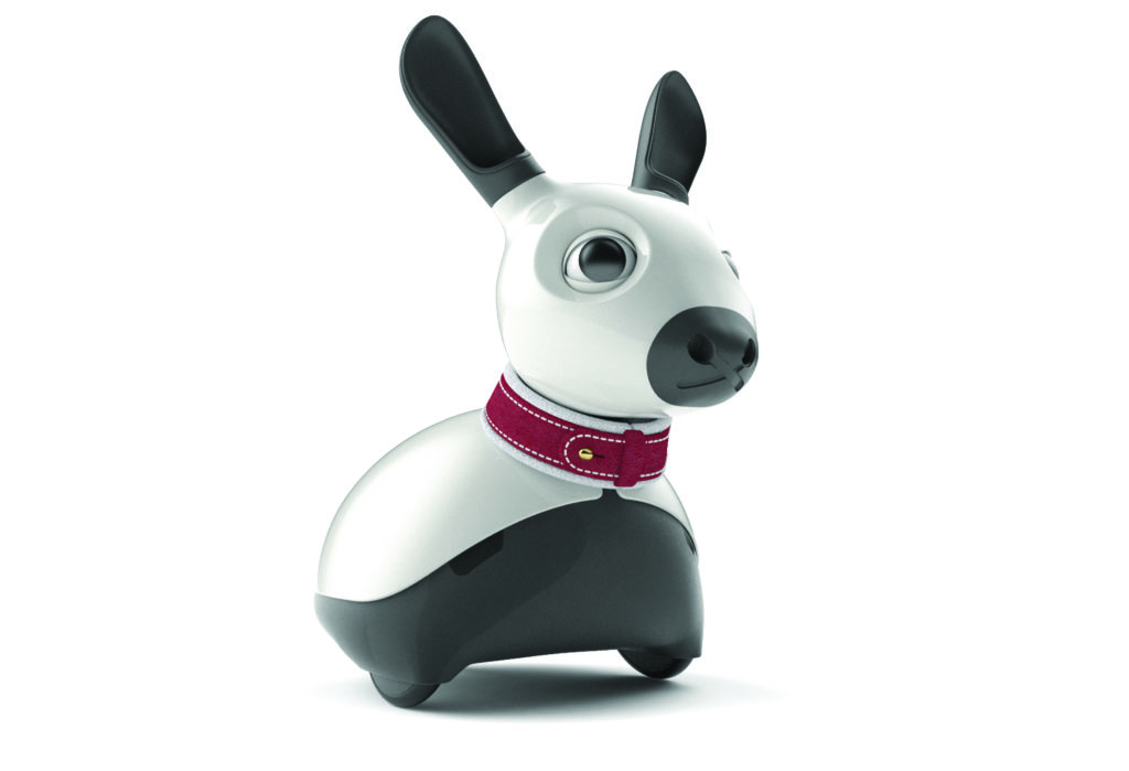 a white and black robot in the shape of a rabbit. It has a red collar around its neck.