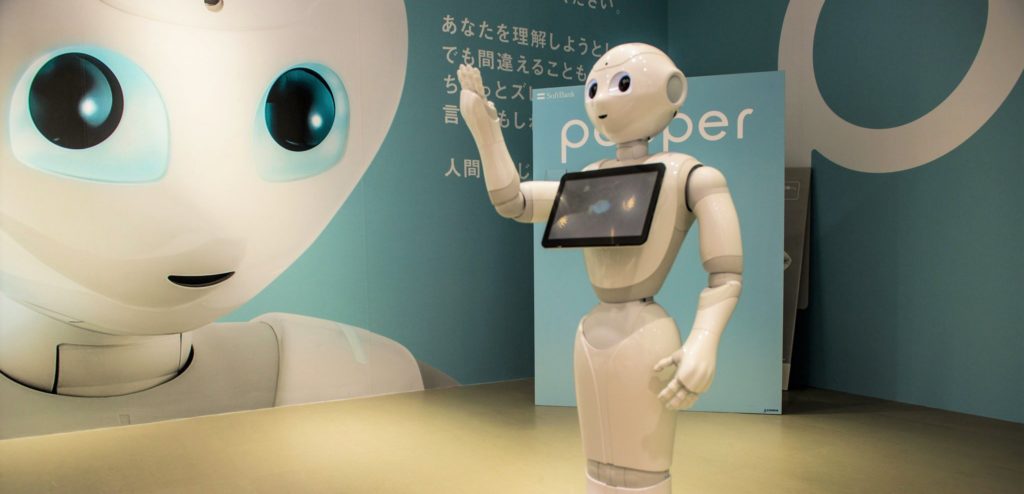 a white robot with a tablet screen across its chest