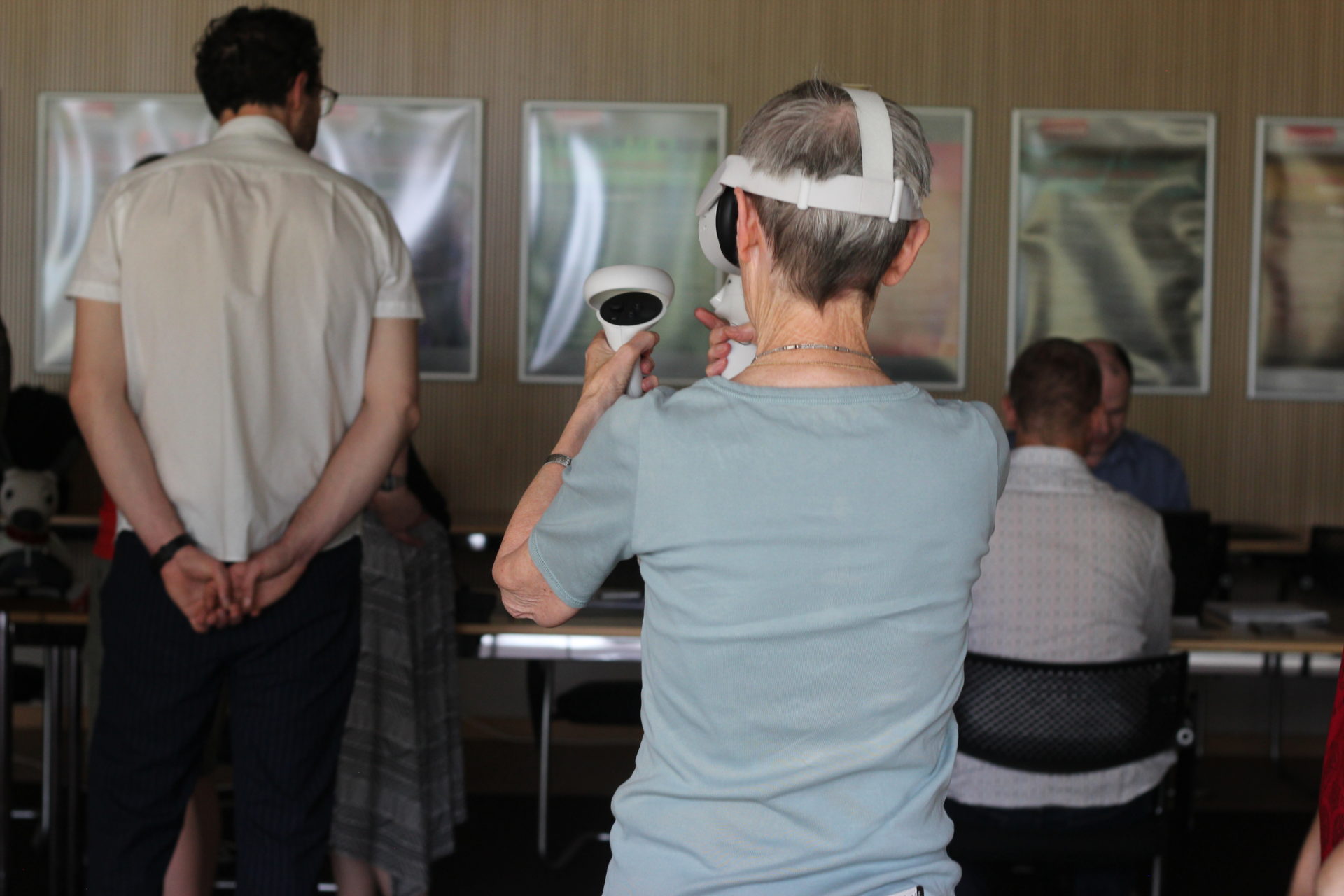 Margrit Shildrick experiences VR telepresence (her back to the camera, Zaki Hussein in the background).