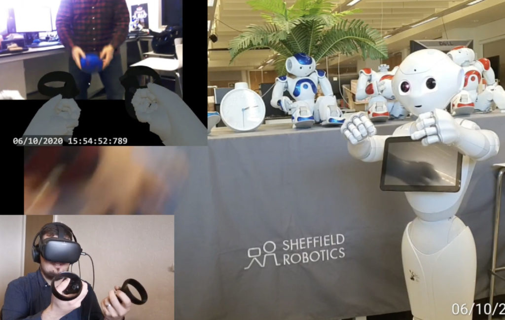 a display table with a cover over it labelled Sheffield Robotics. On the table sits and blue and white robot figure and a clock