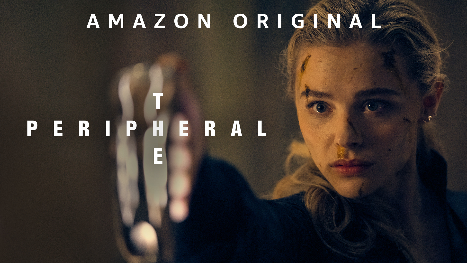 A still from the tv show ‘The Peripheral’ showing the dirty face of actress Chloë Grace Moretz as character Flynne Fisher
